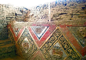 Colorful frieze at the ruins of the adobe city of Chan Chan.