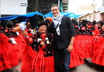 Posing with a woman in traditional Andean dress
