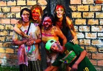 Painted and soaked revelers in Iquitos during Carnaval