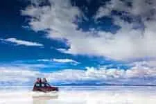 Cover. Racing across Uyuni Salar in Bolivia