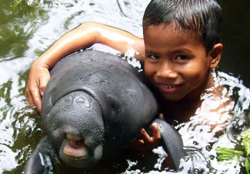 Iquitos boy with Amazon River Manatee (Endangered)