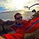 Travel selfie while relaxing riverside in hammock