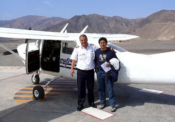 Boarding a light aircraft at the Nazca Aerodrome