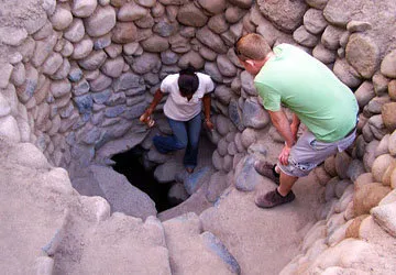 Entering one of the puquios of the Cantayoc Aqueducts
