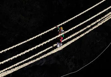 Rebuilding Qeswachaka bridge near Cusco, Peru