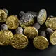 Mini. Golden ear ornaments were worn by Wari noble-women