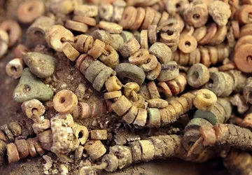 Carved stone beads uncovered in the tomb