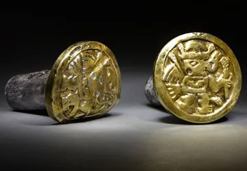 Gold earplugs from the Wari tomb, with winged figures