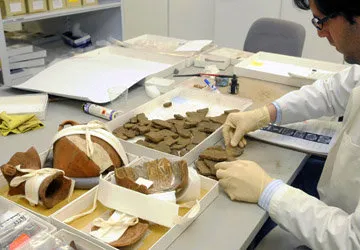 Peruvian student at Yale studying Machu Picchu relics