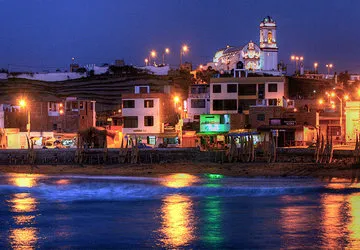 Huanchaco village as seen from the pier in the dusk.