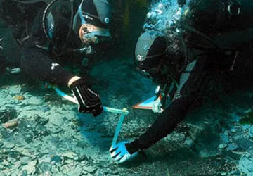 Subaquatic divers during archeological dig in Lake Titicaca