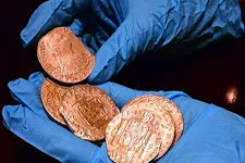 Cover Photo. Examining sunken treasure from Mercedes Shipwre