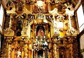 A section of the intricate gold-leaf altar at San Pedro Chur