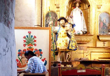 One of the San Pedro Church restorers at work