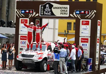 Celebrating finishing Dakar last year in Lima's main square.