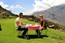 Couple eating lunch while hiking the Choquequirao to Machu P
