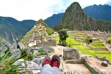 Resting while overlooking the Inca ruins of Machu Picchu Arc
