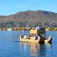 Reed boat from the Floating Islands of Uros sailing Lake Tit