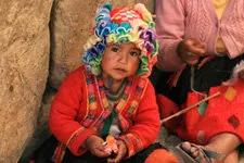 Traditionally dressed girl in the street in Cusco, Peru.