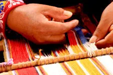 Woman demonstrating traditional weaving in Willoq near Cusco