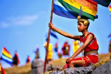 Young man with flag at Sacsayhuaman near Cusco for Inti Raym