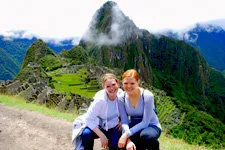 Girls visiting the Inca ruins of Machu Picchu Citadel in Per