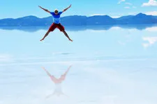 Man leaping in the Uyuni Salar Salt Flats near Potosi, Boliv