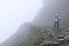 Walking along the fog of the Choro Inca trail near La Paz, B