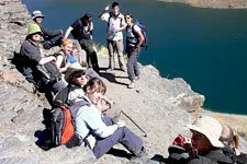 Group of trekkers resting at Lake Khota on Tuni Trail in Bol