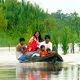 Locals navigating the Amazon River near Iquitos, Peru.