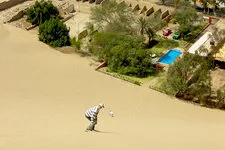 Sandboarding by Huacachina Oasis in Ica, Peru.
