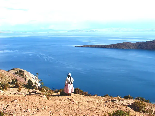 Woman looking over Lake Titicaca from Sun Island in Bolivia.