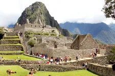 Visiting the Inca ruins of Machu Picchu in Peru.